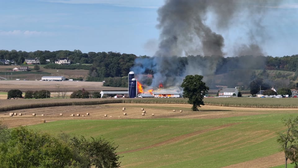 Barn fire sending smoke across farm fields