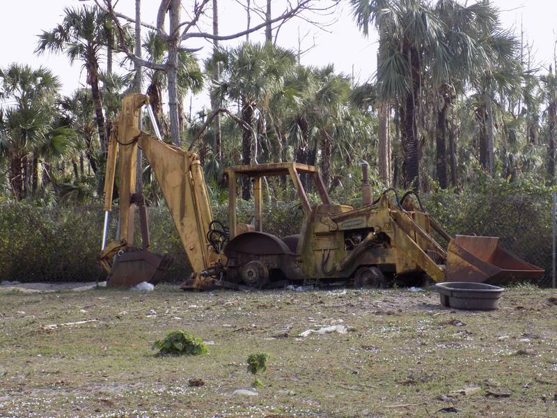 Farm equipment destroyed by a brush fire on an agricultural property