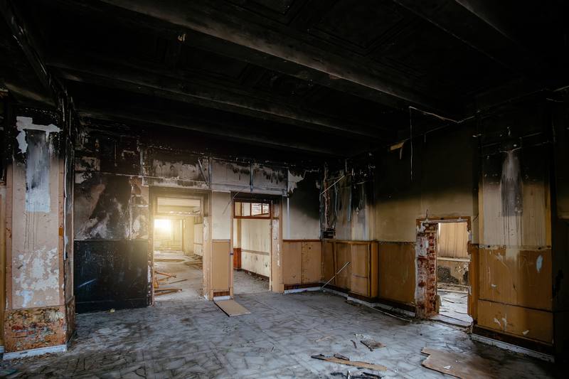 Burned interior buildout and ceiling of a commercial building after a fire