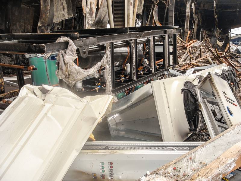 Fire-damaged commercial kitchen equipment and inventory