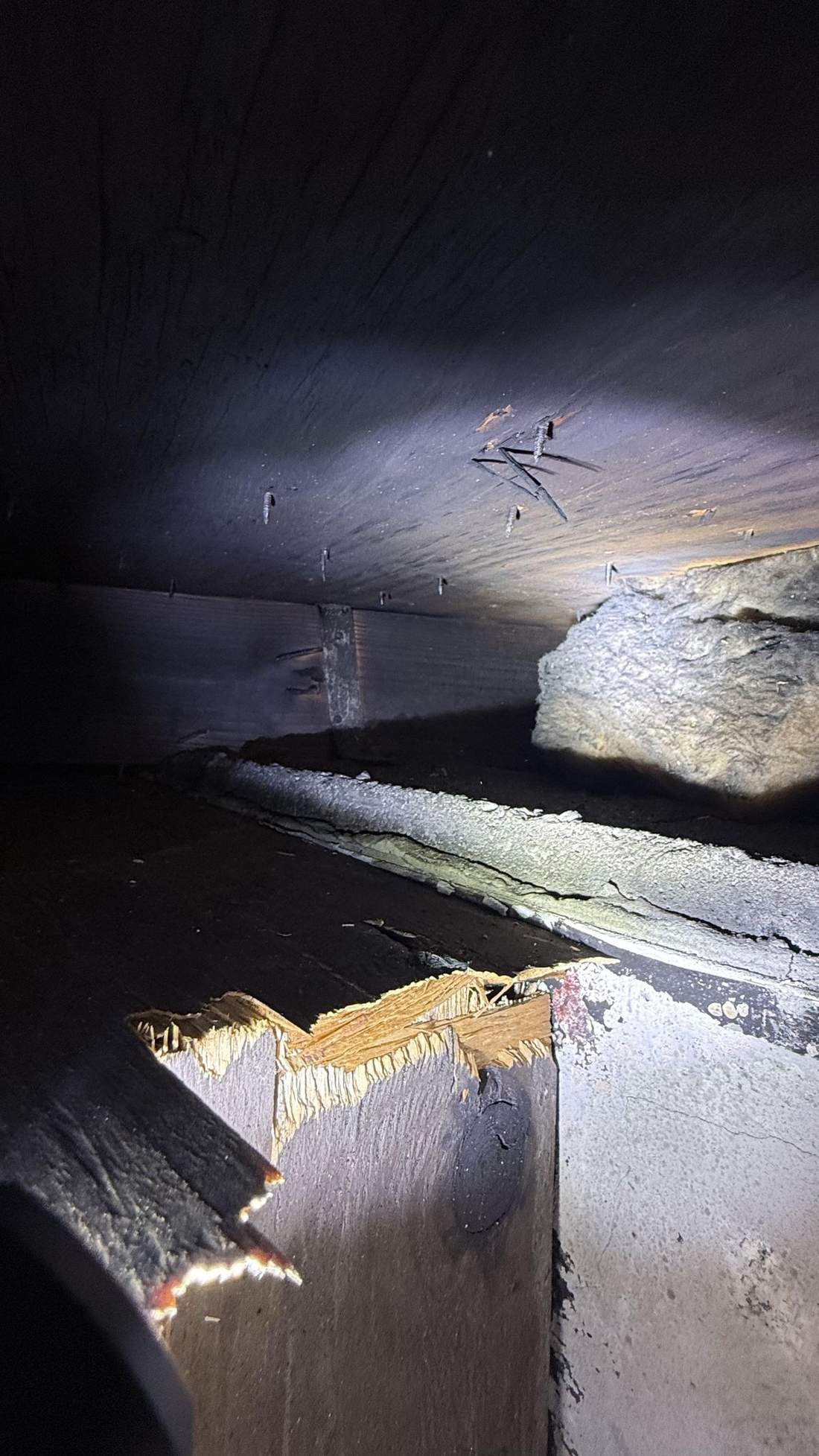 Charred attic trusses after a fire — the kind of claim Homeland handles for Edison, NJ property owners