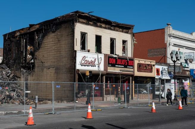 Fire-damaged commercial storefront in West New York, NJ