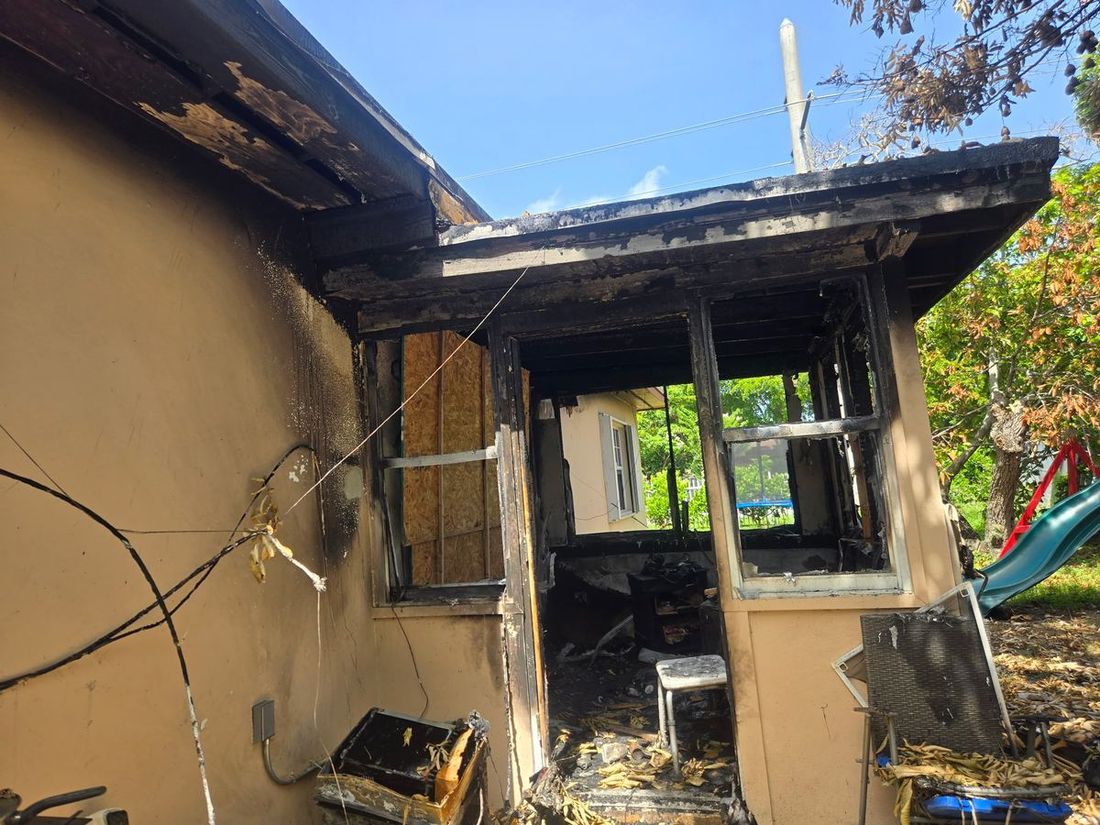 Burned-out room and charred exterior after a house fire — the kind of claim Homeland handles for Gainesville, FL property owners