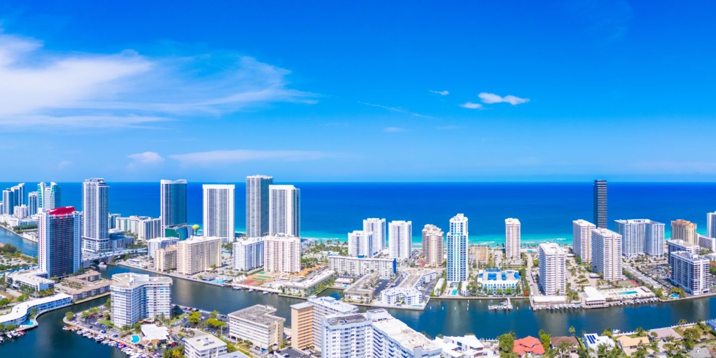 Aerial view of Hallandale Beach condo towers along the Intracoastal Waterway and the Atlantic Ocean