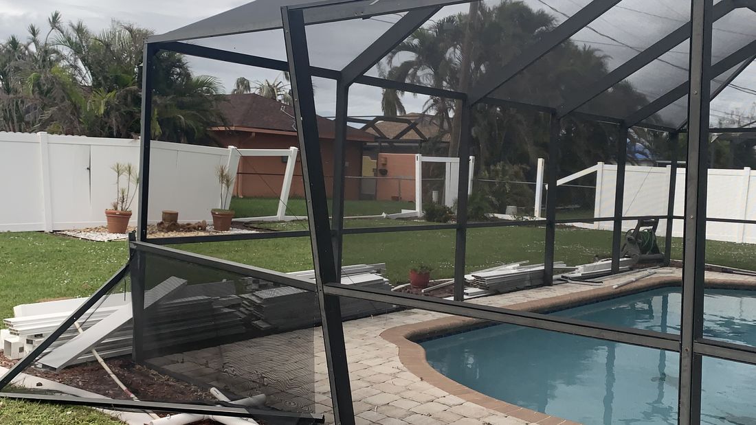 Pool screen enclosure bent and torn by hurricane winds — the kind of claim Homeland handles for Cocoa Beach, FL property owners
