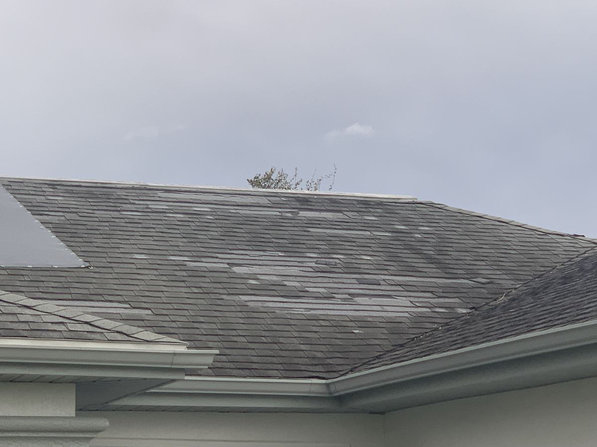 Hurricane roof damage at a home in Homestead, FL