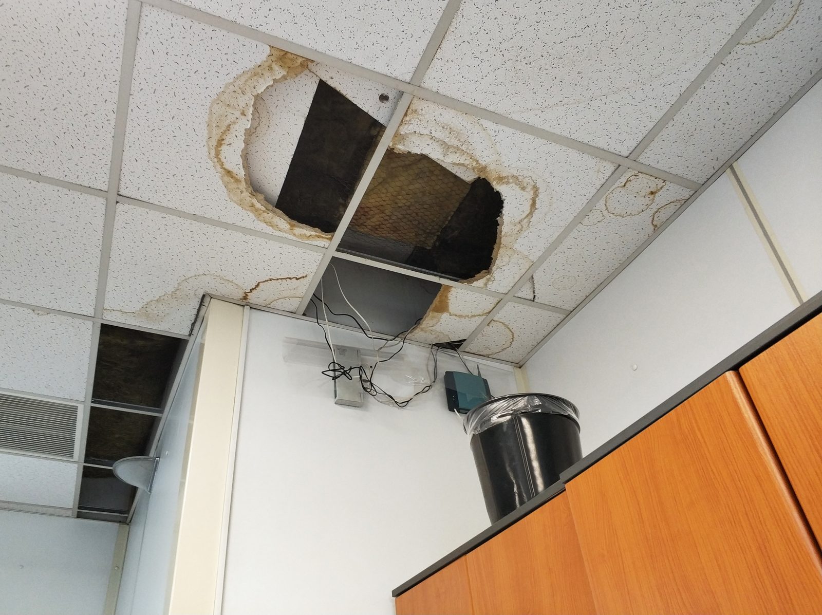 Collapsed drop-ceiling tiles from a water leak in a medical office