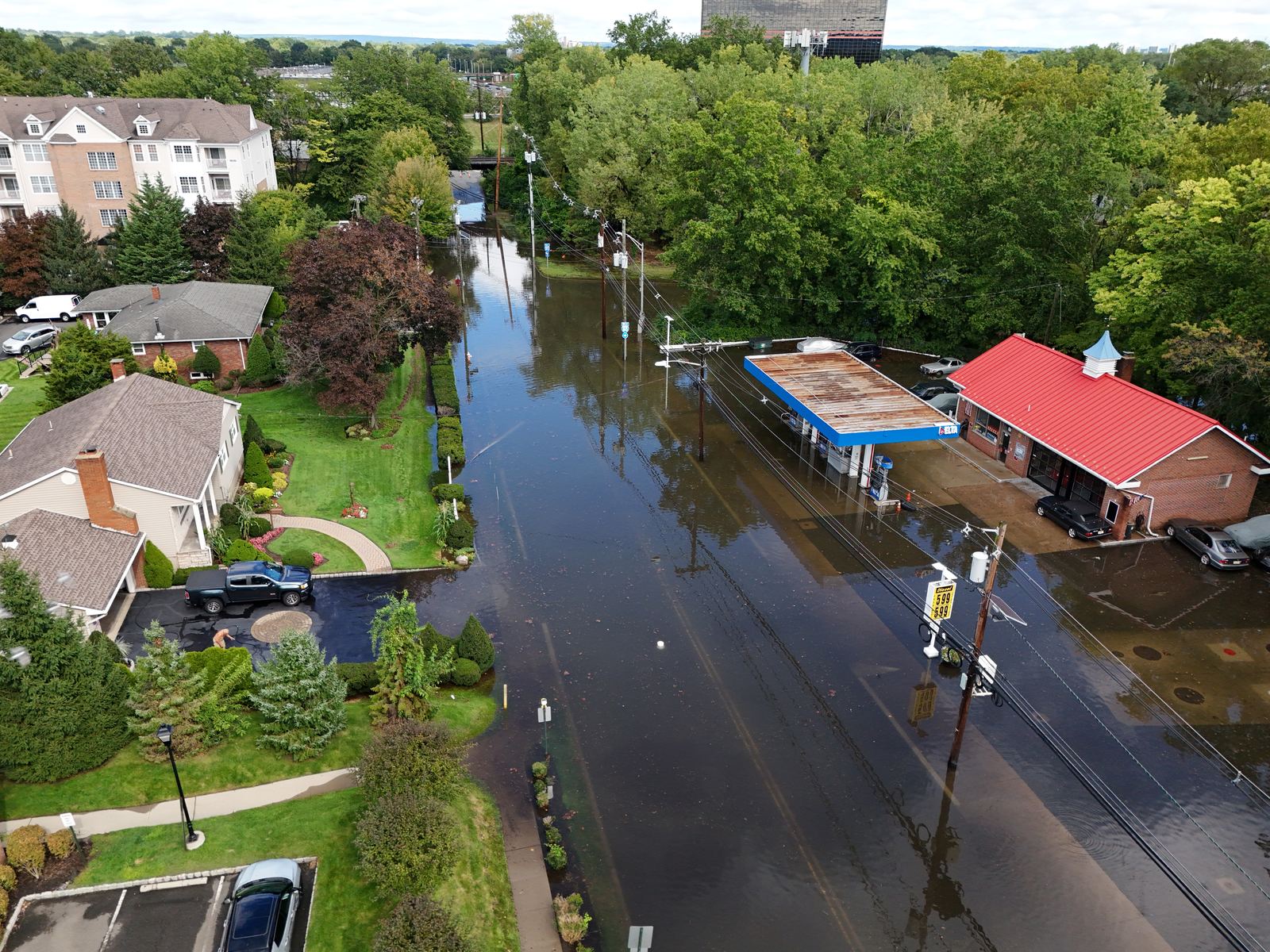 Aerial view of a flooded residential street and shops in New Jersey after heavy rain
