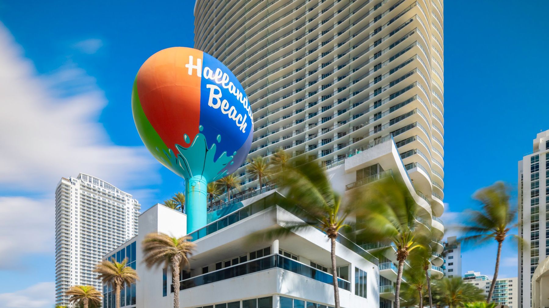 Hallandale Beach beach-ball water tower and oceanfront condo towers — Homeland Public Adjusters serves Hallandale Beach property owners