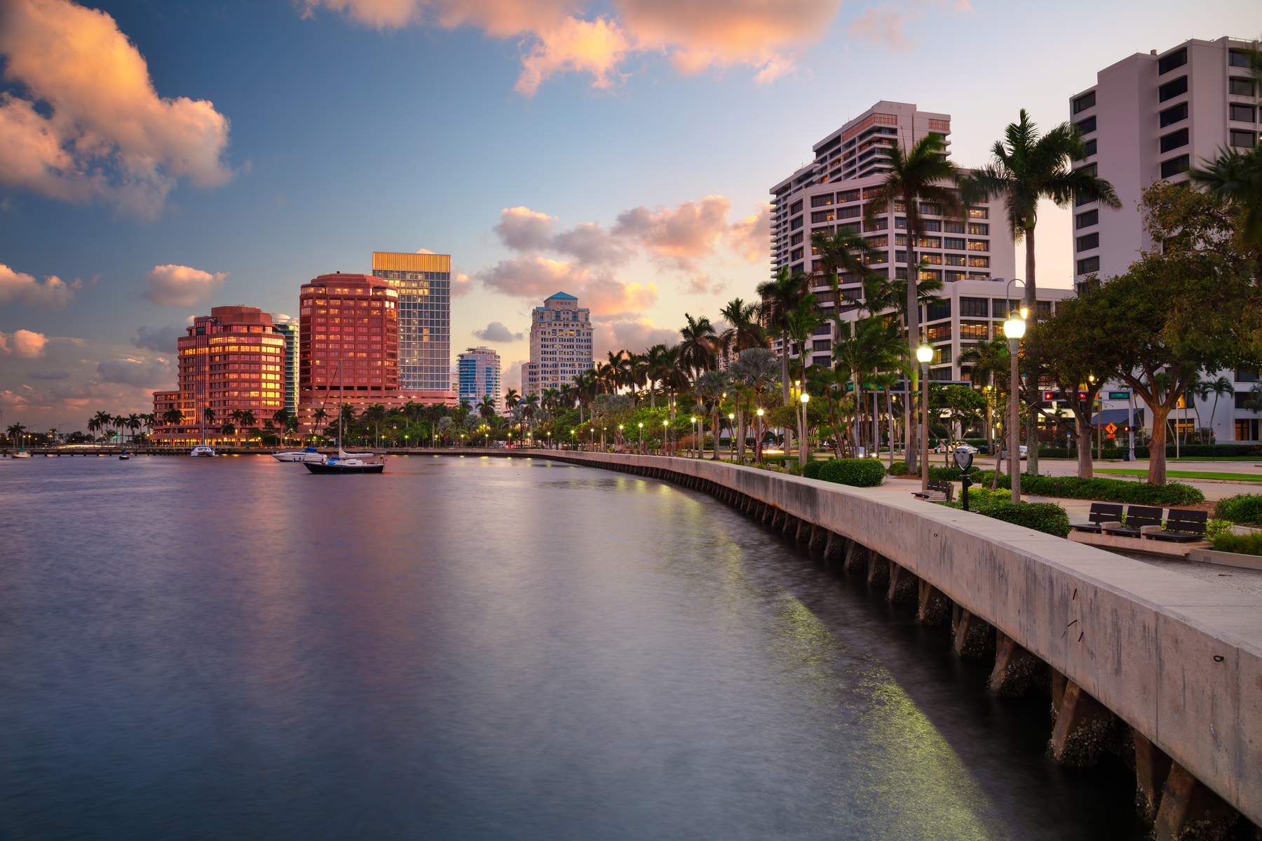 West Palm Beach skyline along the Intracoastal Waterway at dusk in Palm Beach County, Florida — Homeland Public Adjusters serves Palm Beach County property owners