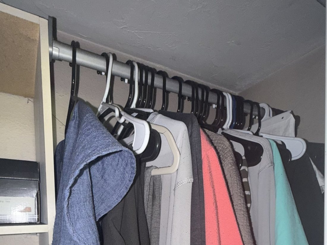 A renter's closet of clothing after smoke damage from a fire in another unit
