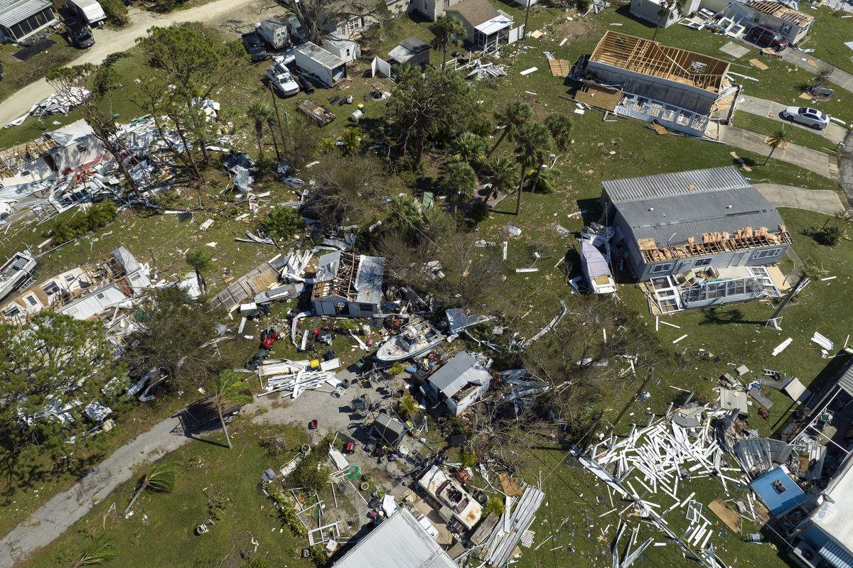 Aerial view of tornado damage to homes in Port St. Lucie, FL