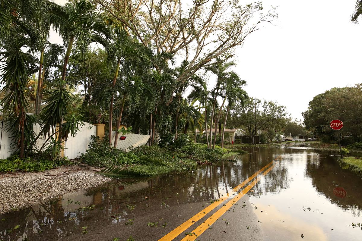 Flooded residential street after a tropical storm in Pompano Beach, FL