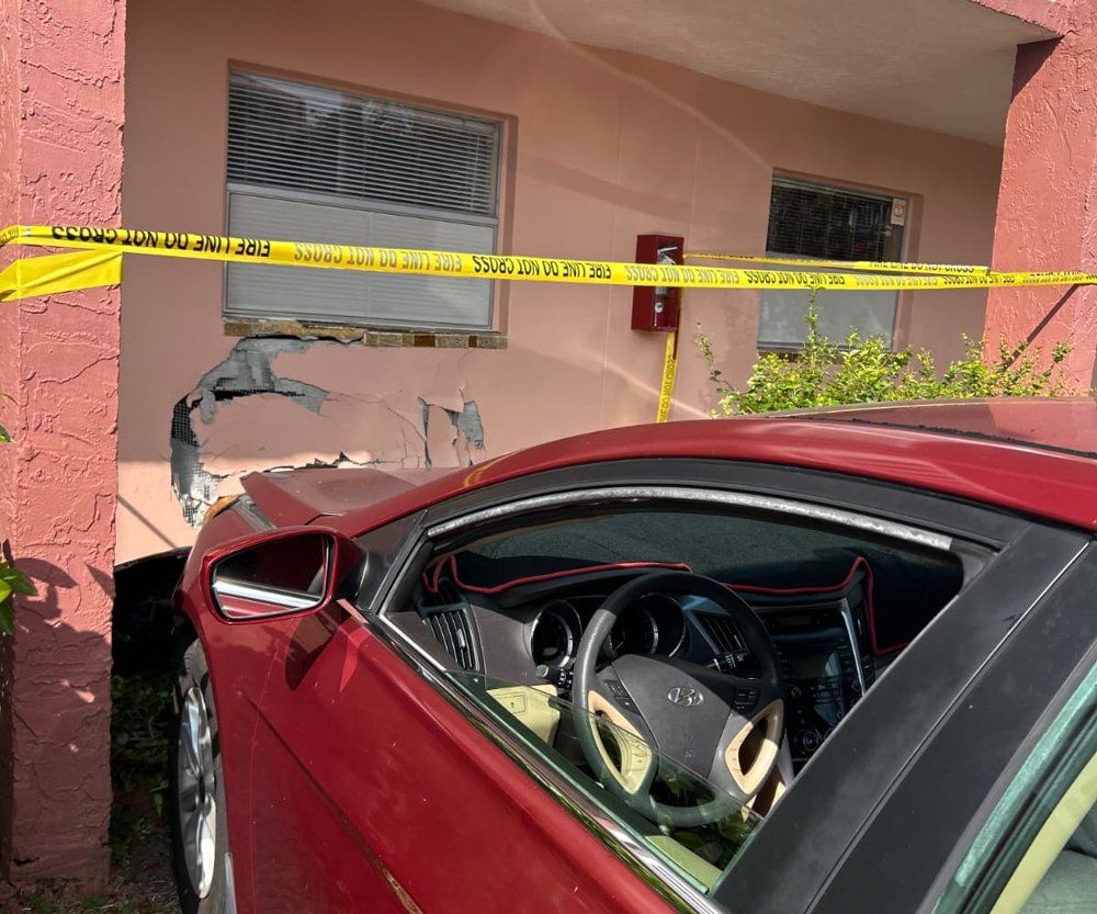 Vehicle crashed into the front of a building, wall and glass storefront destroyed