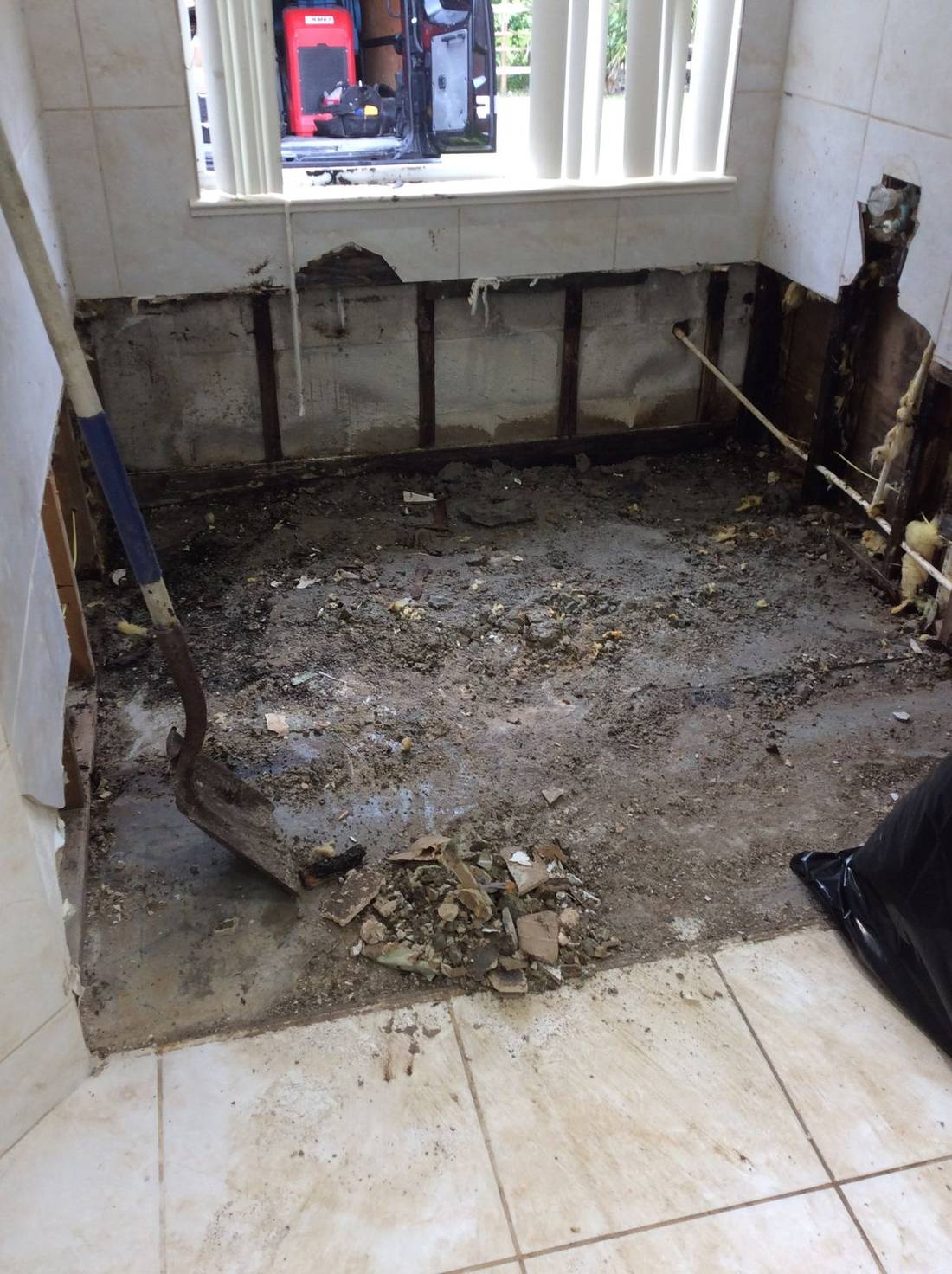 Bathroom gutted to the slab after water damage — the kind of claim Homeland handles for St Augustine, FL property owners