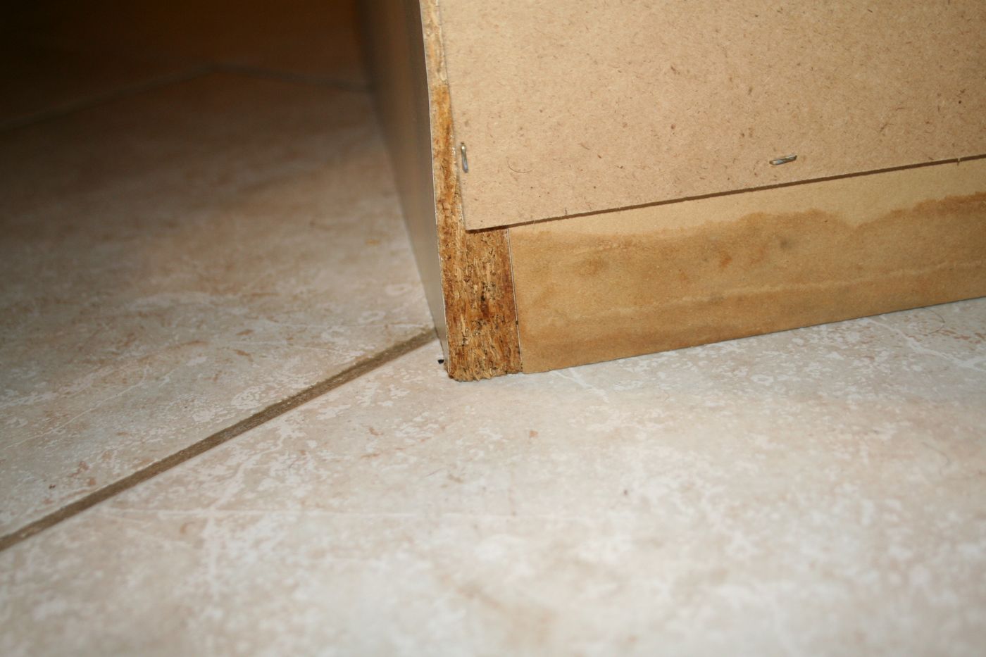 Water-damaged cabinetry base from a leak — the kind of claim Homeland documents for Lee County, FL property owners