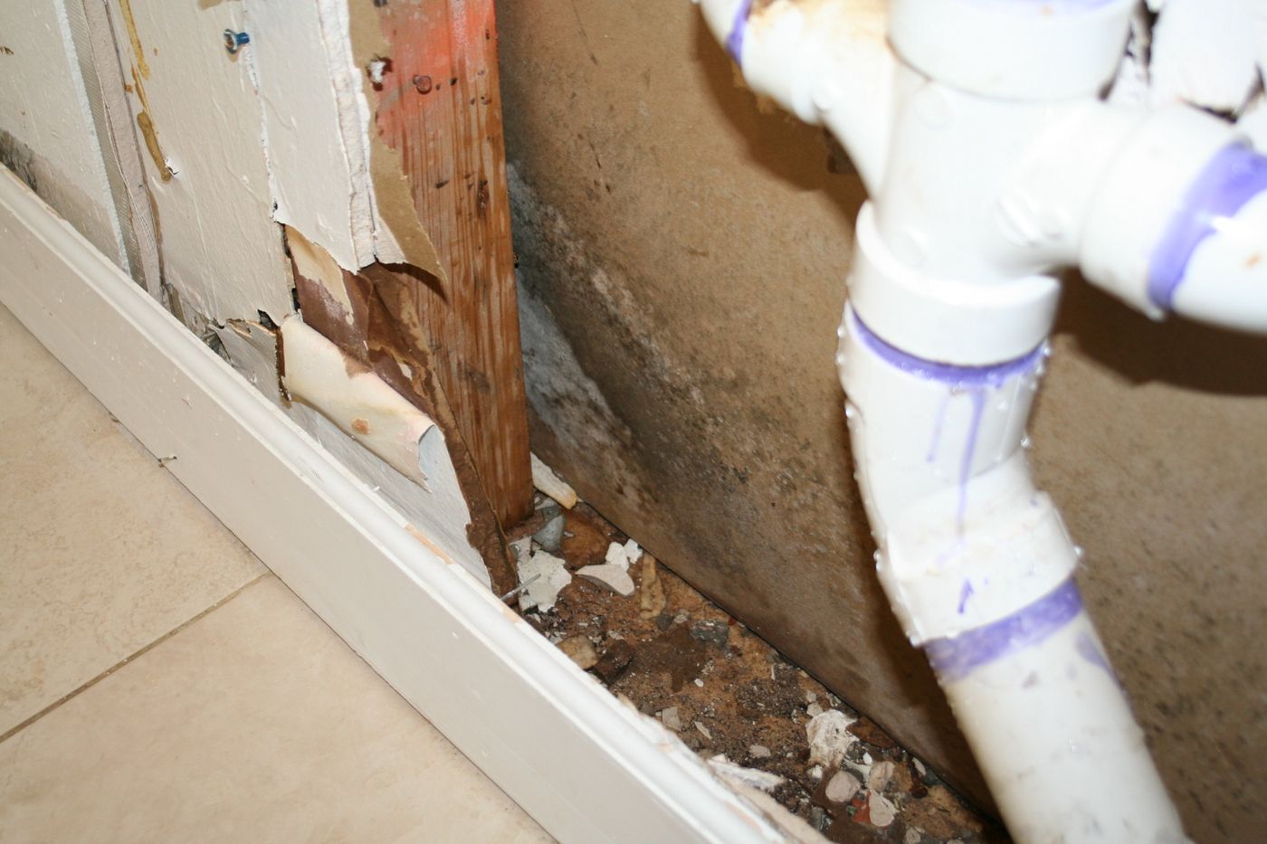 Water-damaged baseboard and flooring from a leak — the kind of claim Homeland documents for Palm Beach County, FL property owners