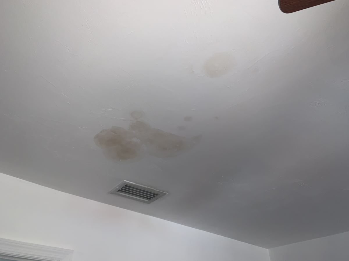 Ceiling water stains from a leak at a property in Jacksonville, FL