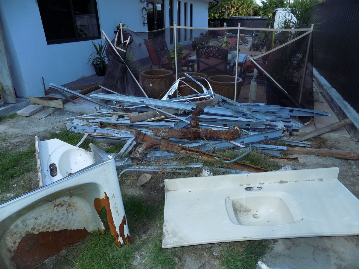 Old plumbing fixtures removed during a water damage repair in Miami, FL