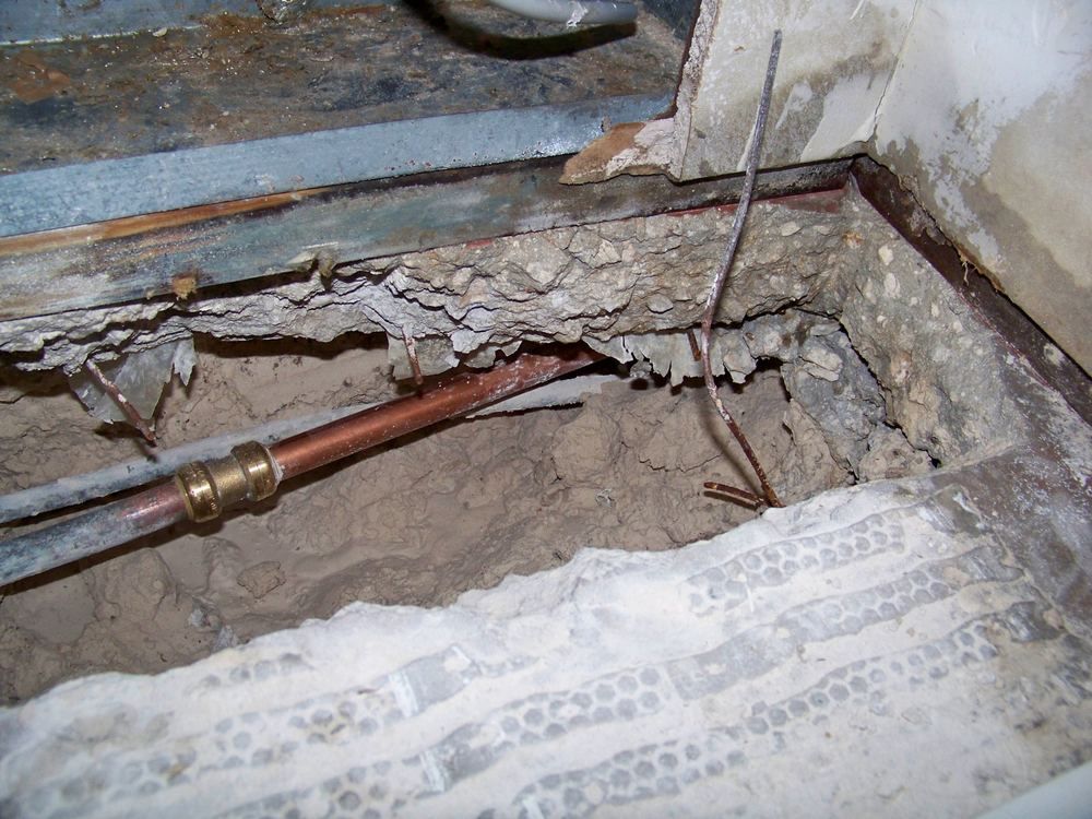 Wall opened to a leaking pipe and water-damaged cavity — the kind of claim Homeland handles for Jersey City, NJ property owners