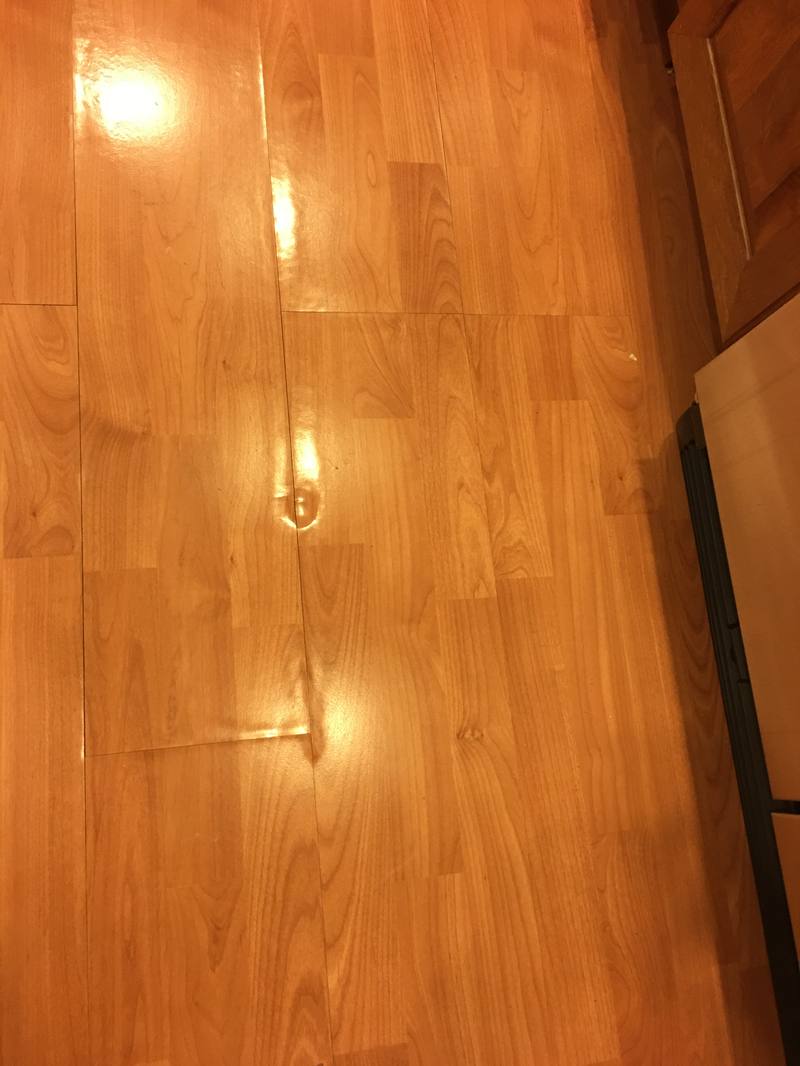 Warped and buckled laminate flooring from water damage
